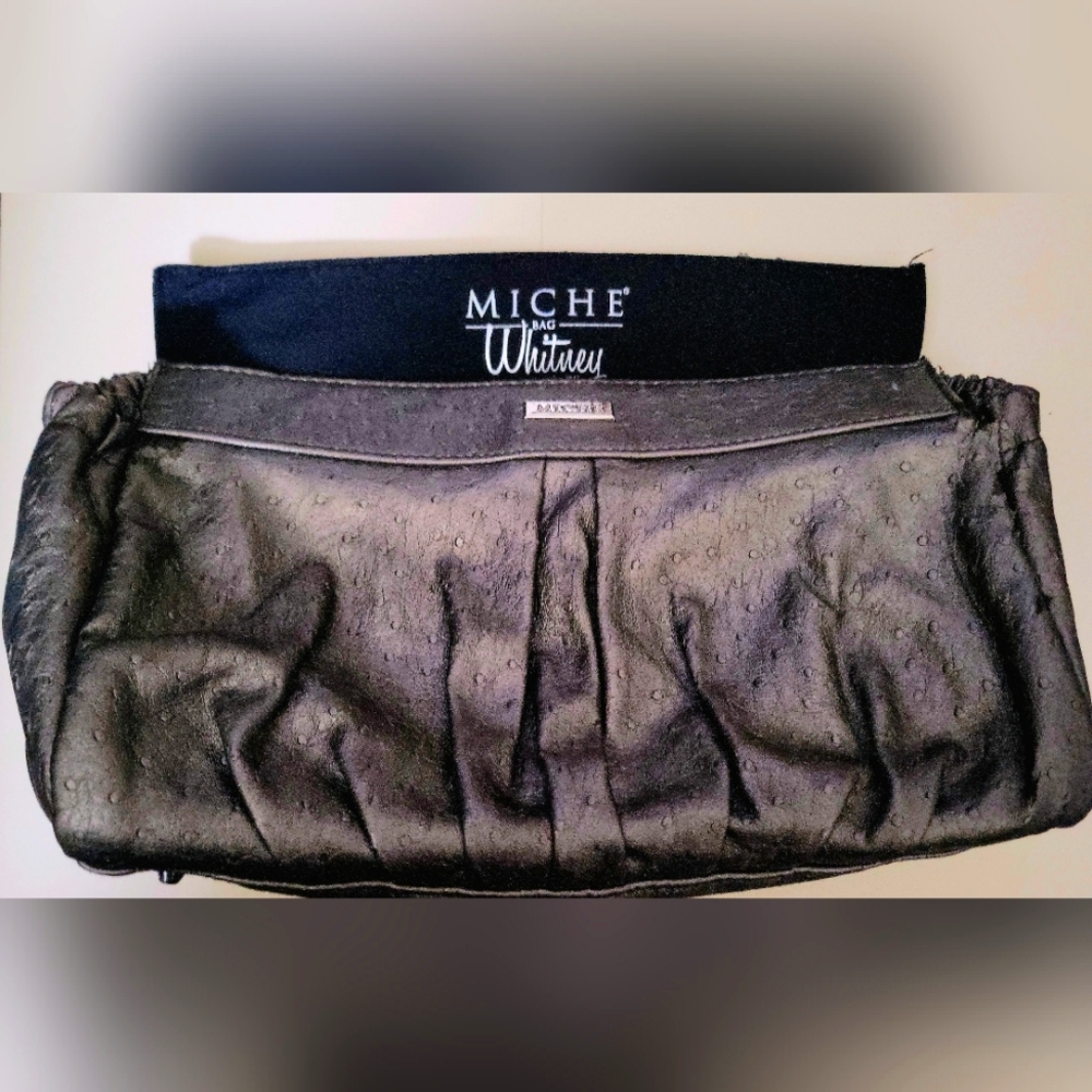 Miche' purse is vintage used but in good condition with 5 shells.